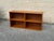 Vintage Danish Modern low bookcase crafted in teak, circa 1960s–1970s. Clean rectangular form with a central divider and...