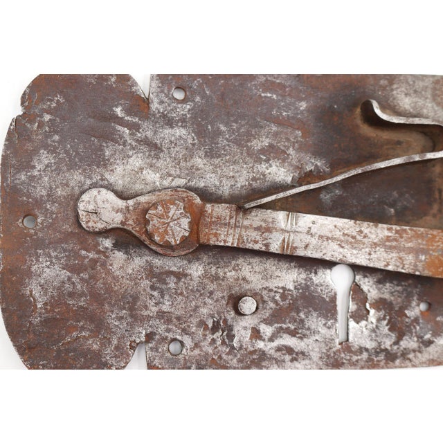 18th century hand forged wrought iron surface mount rim lock with a distressed finish. The original mounting screws are...