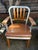 A beautifully composed vintage Shaw Walker armchair featuring a striking mix of brushed steel, warm-toned wood, and...