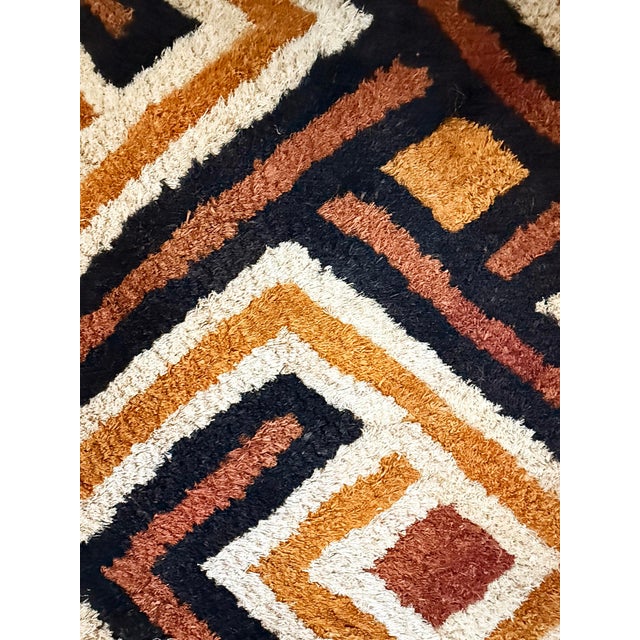 Traditional vintage Kuba grass textile handmade from the indigenous people of the Congo. Bold geometric patterns created...