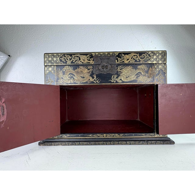 This is a mid 20th century vintage hand painted Chinese export large dresser box. this box has two doors to the front with...