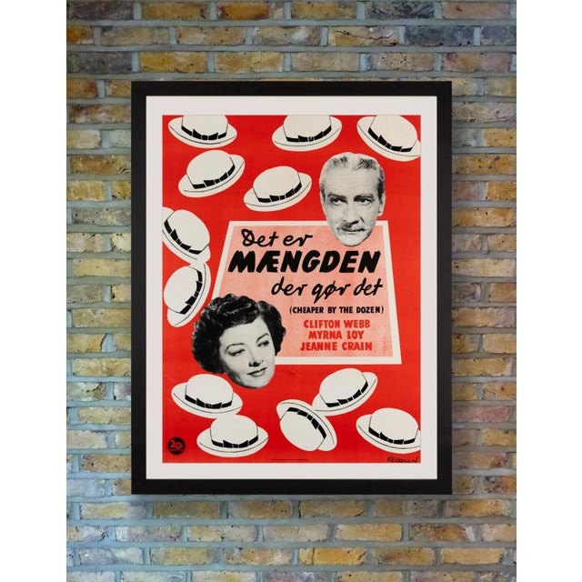 With it's twelve jolly little hats, this charming poster by Klitgaard advertised the first Danish release of the fun-...