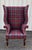 Vintage English Wingback Chair in Ralph Lauren wool plaid tartan on turned mahogany legs with brass casters. There is no...