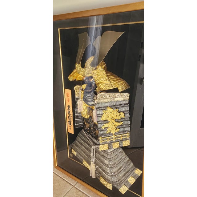 Large framed Japanese samurai armor display (yoroi), presented in a glass-fronted gold-trim shadowbox. The miniature armor...