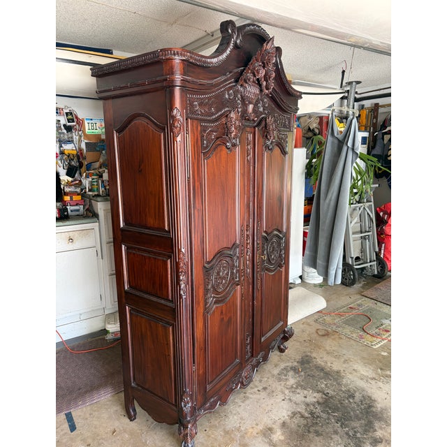 Vintage Mahogany Armoire / Wardrobe with Decorative Floral removable cornice. Solid Wood armoire is a vintage freestanding...