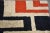 A mid century modern red off white and blue rug with an abstract geometric vibe made by Canterbury House. 72” X 43”