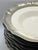 A refined set of nine Italian pasta plates by Arte Italica, featuring classic white ceramic centers framed by hand-...
