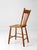 An antique plank seat chair featuring a hand-shaped saddle seat and a simple four-spindle back. Crafted in solid wood, the...