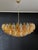 Elegant Italian pendant light made from 185 multicolored Murano glasses "poliedri". Structure in gold and brass colored...
