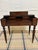 Solid Mahogany spinet-style writing desk, manufactured by the Colonial Manufacturing Company, dating to the early 20th...