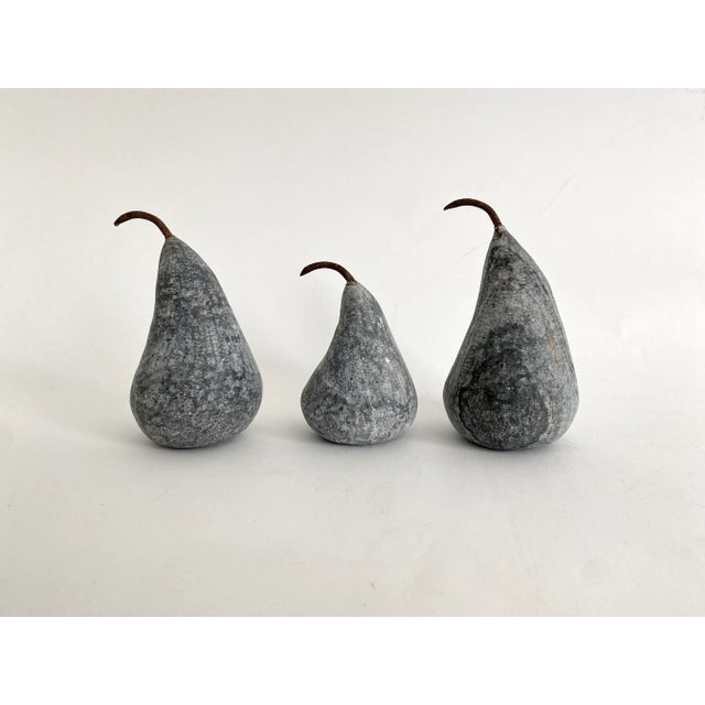 Medium size solid gray marble pear with metal stem. Slight variations in color and dimensions. Available in two sizes.
