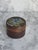 Beautifully painted flowers on a round, wood turned trinket box with lid. This would be a great accent piece in an office...