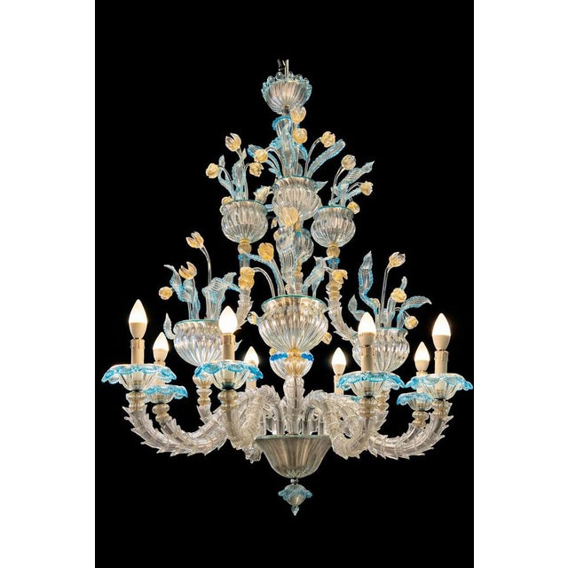 Chandelier Rezzonico in artistic glass entirely mottled with gold leaf. The artwork is designed in antique baroque and...
