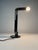 Illuminate your space with timeless elegance and unparalleled style with the iconic black vintage periscopio table lamp,...