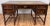 Handsome antique Jacobean style desk with barley twist legs, removable glass top, and elaborately carved burled wood...