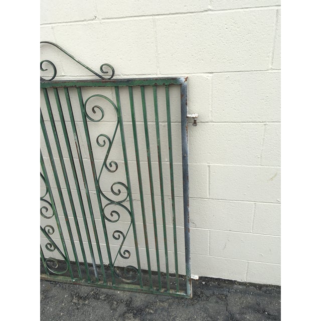 Beautiful vintage or antique wrought iron gate. Measures 4’ 7” tall x 3’ 10” wide, 1/2”-1” thick. Wear consistent with...