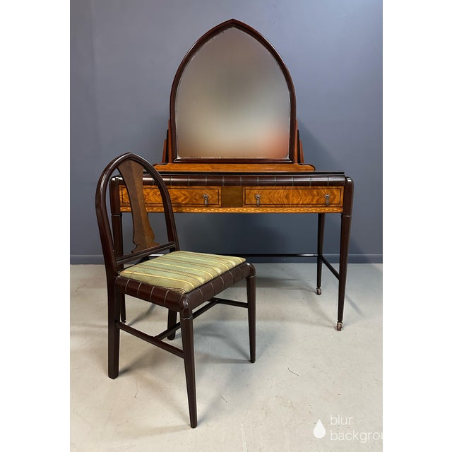A tour de force of Art Deco styling, this vanity retailed by J.B. Van Sciver, showcasing the geometric refinement and...