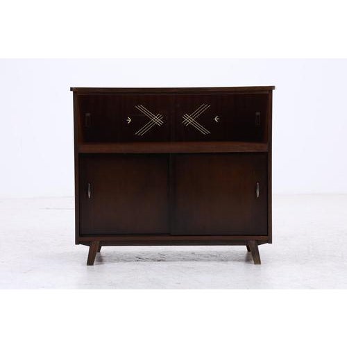 Vintage chest of drawers with ample storage space and a beautifully designed front. The upper section features sliding...
