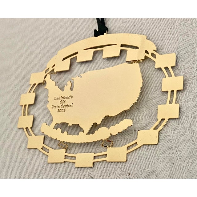A commemorative ornament honors the 200th anniversary of the Louisiana Purchase (1803-2003). The center of the ornament...