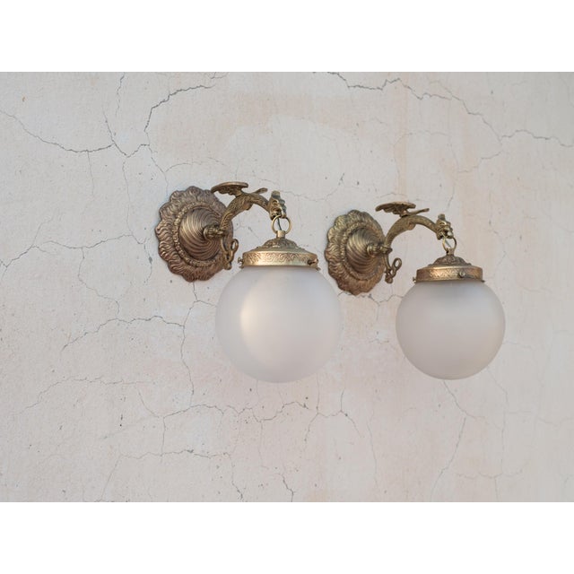 Spectacular and Exceptionally Rare Set of Four (4) 1950s Spanish Empire Style Cast Brass Wall Sconces with Heavy Artisan...
