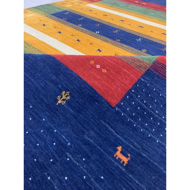 Beautiful Gabbeh Navy Handmade Wool Rug, Country of Origin: India. This exceptional piece draws upon the nomadic Gabbeh...