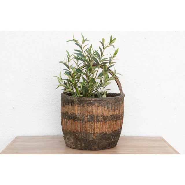 Discover the honest beauty of enduring hand-craftsmanship with this magnificent large antique woven basket, complete with...