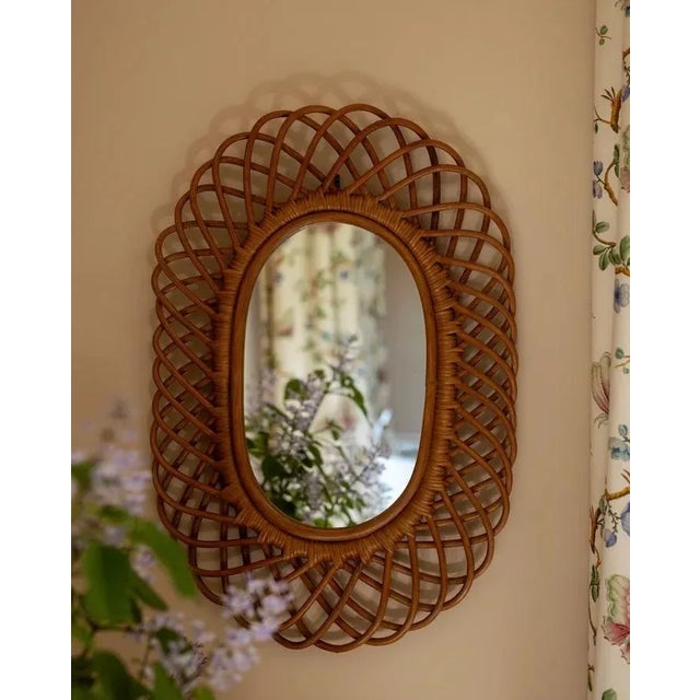 Such a charming oval rattan mirror, inspired by an antique Louise found in France, this piece is handmade from woven...