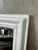 An elegant antique mirror dating from 1900, featuring a wooden frame with clean, timeless lines. We have completely...
