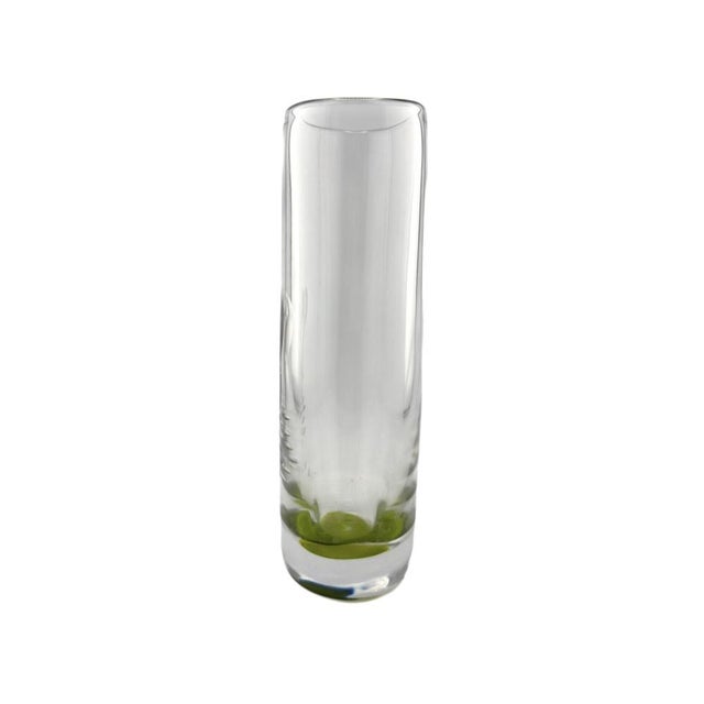 A Swedish art glass vase designed by Vicke Lindstrand for Kosta, dating to the 1960s. Executed in clear glass with a soft...