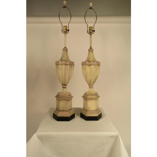 Pair of 1950s plaster finial lamps. White and pink. Need to be wired. Some of the pictures came out yellow, the true color...