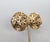 1960s round goldtone with cut out flowers clip earrings. Marked crown "TRIFARI ©" on the clips. Measure: 1 3/8 inches...