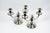 The formal vocabulary - baluster, gadrooned base, volute arm - is part of the classic repertoire of French table...