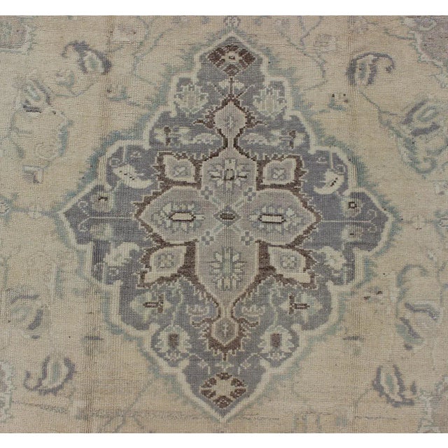 Textile Vintage Turkish Medallion Oushak in Muted Yellow, Blue, Green, Peach & Lilac For Sale - Image 7 of 9