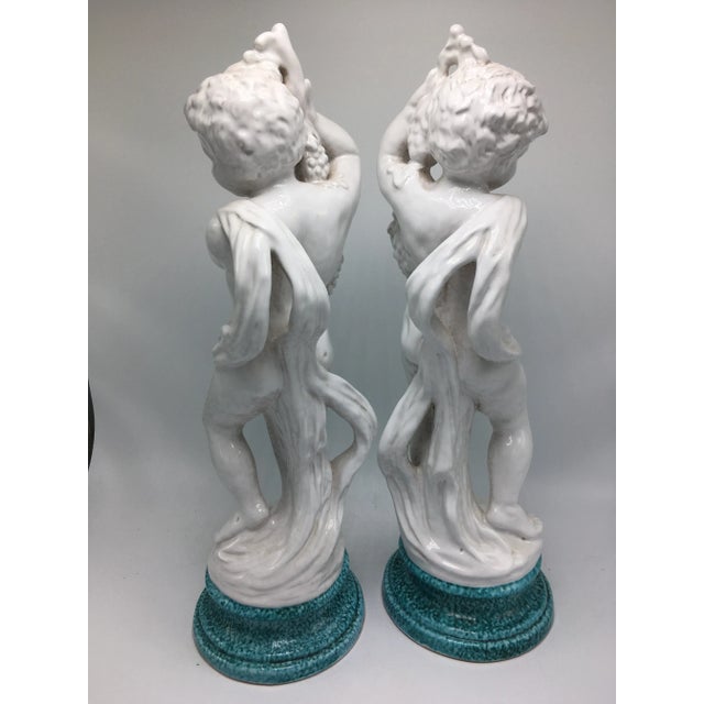 Outstanding pair of Italian cherubs on pedestals. These gorgeous decorative pieces are collection worthy! Solid white on...