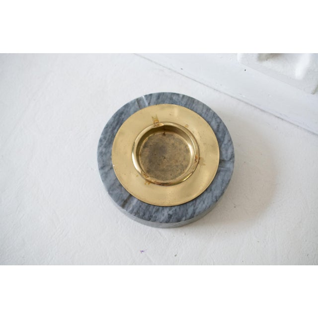 This listing is for a mid-century vintage, glass faux marble and brass ashtray in the style of Angelo Mangiarotti. The...