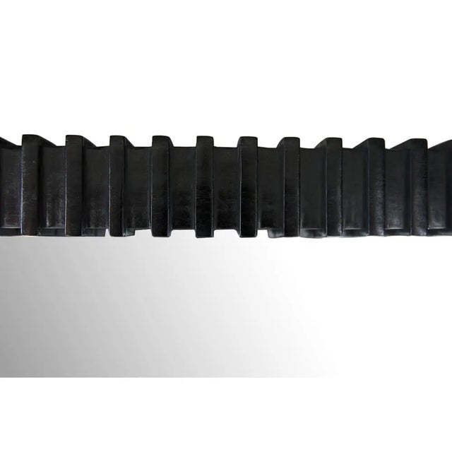 The Rift Mirror is a statement of contemporary elegance, crafted from Mindi and Mirror, finished in a captivating Charcoal...