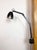 This vintage Industrial adjustable wall lamp was produced by Memlite in United Kingdom during the 1960s. The lamp has a...