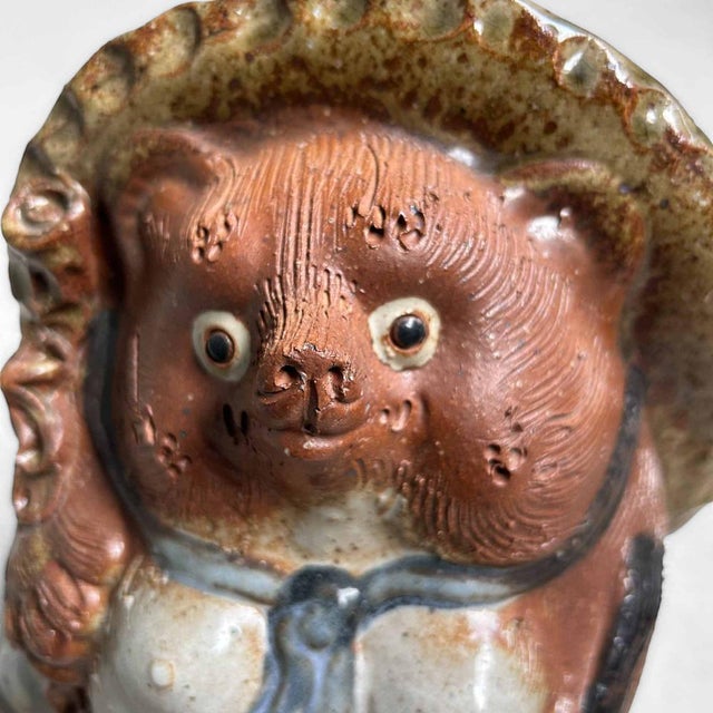 Cheerful Tanuki Statue, Shigaraki Ware, 1970s, Shōwa Period, Japan. This Tanuki statue, crafted from Shigaraki clay,...