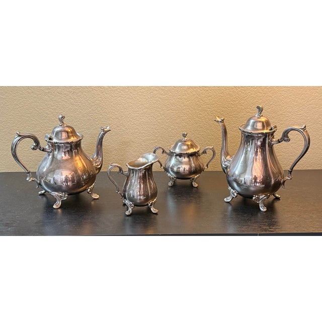 Design Plus Gallery presents a Set of Four Silver-Plate Tea Service from Webster Wilcox. The silver tea set is a prized...