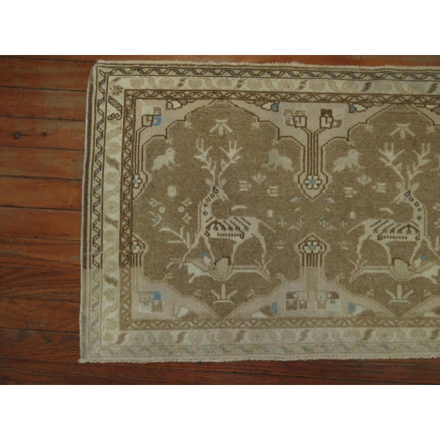 A pair of neutral Persian Tabriz rugs from the mid-20th century with a set of reindeer's staring at each other, Measuring...