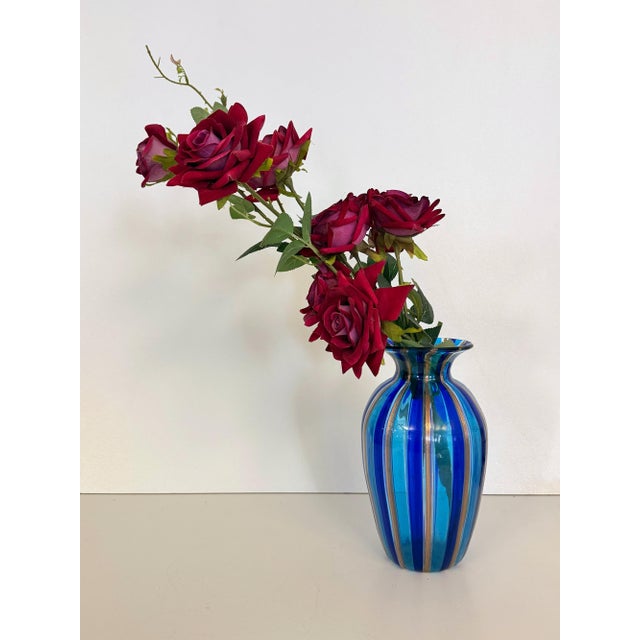 Made in Italy, 1980s. This wonderful vase is made with two-colored Murano hand-blown glass canes and avventurine. It is a...