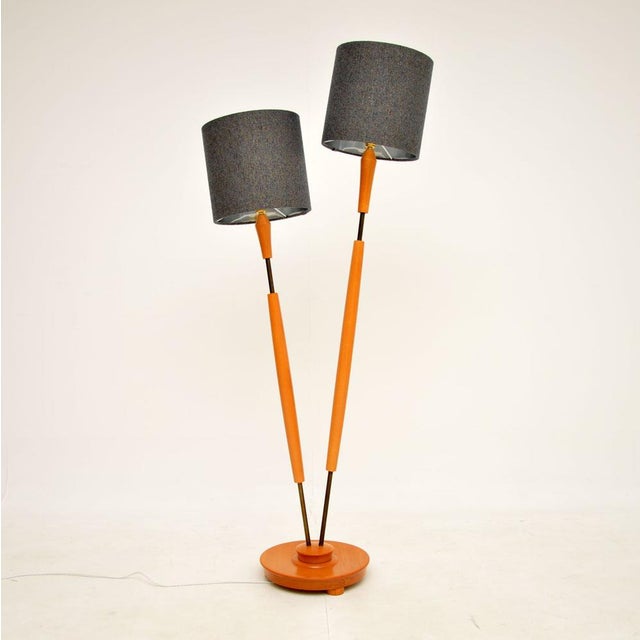 A stylish and very well made vintage floor lamp with two independent lamp stands coming from one base. This was made in...