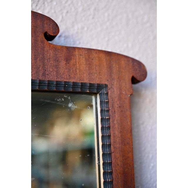 Elegant format, noble materials, simple lines, and fine details are all present in this magnificent 1900 mirror. The frame...
