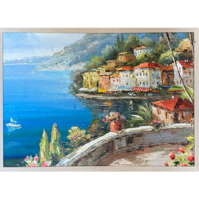 This lovely Italian coastal landscape is displayed in a custom made ornamented and gilded frame. Overall dimensions are 26...