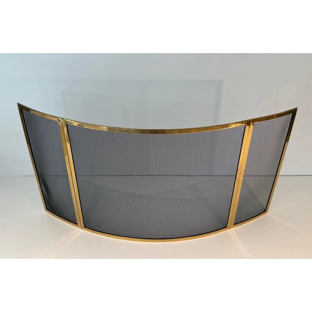 This designer curved fireplace screen is made of brass and wire mesh. This fire screen is made of 3 curved brass panels...