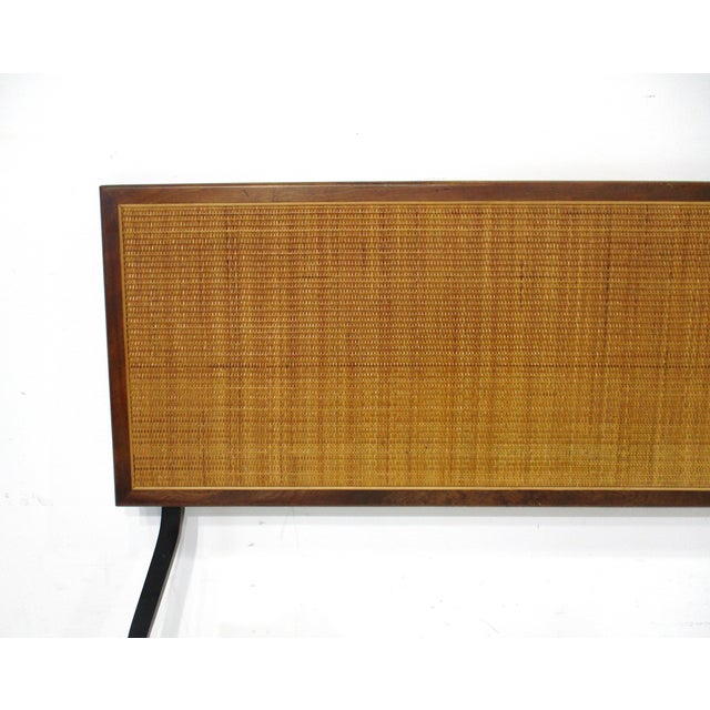 A walnut framed full sized headboard with natural tight woven caned insert with metal hardware to mount to your existing...