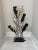 Vintage unique sculptural wrought iron wine rack that holds six full bottles of wine or champagne. Featuring a unique base...
