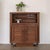 Incredible carved wood bar cabinet from France, 1940s. Beautiful carved woven detail on two front doors. Open upper level...