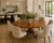 An antique Victorian burr walnut 6 seater oval tilt-top centre dining table with a beautifully figured top and an...