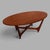 A sculptural mid century oval teak coffee table with an Astro-inspired base and softly organic proportions. The generous...